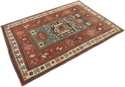Corner detail of 1900s Kazak rug showing border pattern and Wool pile
