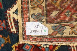 Corner detail of 1900s Kazak rug showing border pattern and Wool pile