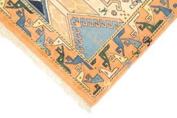 Backside of handmade New Kazak rug showing knot structure and weave density