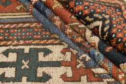 Corner detail of 1900s Kazak rug showing border pattern and Wool pile