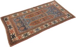 Corner detail of 1900s Kazak rug showing border pattern and Wool pile