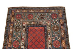 Surface texture of 1900s Kazak rug with natural Wool and intricate pattern