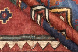Corner detail of 1900s Kazak rug showing border pattern and Wool pile