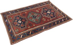 Corner detail of 1900s Kazak rug showing border pattern and Wool pile