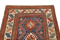 Surface texture of 1880s Kazak rug with natural Wool and intricate pattern