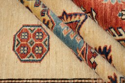 Corner detail of New Kazak rug showing border pattern and Wool pile