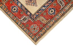 Backside of handmade New Kazak rug showing knot structure and weave density