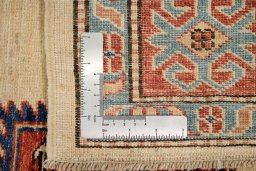 Full view of New Kazak rug from Pakistan, 194 × 155 cm in Cream tones
