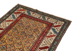 Surface texture of 1900s Kazak rug with natural Wool and intricate pattern