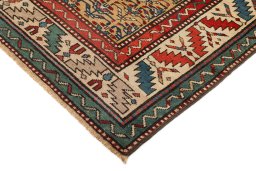 Backside of handmade 1900s Kazak rug showing knot structure and weave density