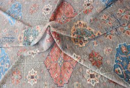 Backside of handmade New Kazak rug showing knot structure and weave density