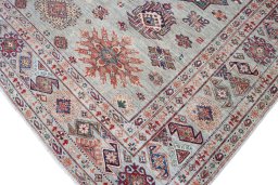 Full view of New Kazak rug from Pakistan, 367 × 274 cm in Multi Color tones