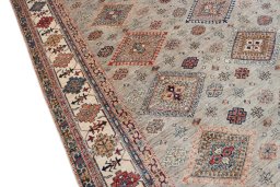 Backside of handmade New Kazak rug showing knot structure and weave density