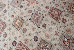 Central medallion detail of New Kazak rug from Pakistan