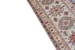 Backside of handmade New Kazak rug showing knot structure and weave density