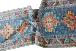 Backside of handmade New Kazak rug showing knot structure and weave density