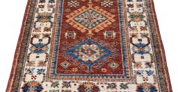Surface texture of New Kazak rug with natural Wool and intricate pattern