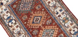 Backside of handmade New Kazak rug showing knot structure and weave density