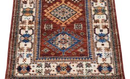 Surface texture of New Kazak rug with natural Wool and intricate pattern