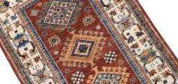 Backside of handmade New Kazak rug showing knot structure and weave density