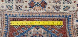 Close-up detail of New Kazak rug from Pakistan showing Wool weave