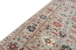 Backside of handmade New Kazak rug showing knot structure and weave density