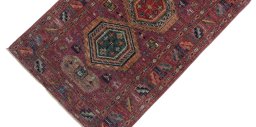 Backside of handmade New Kazak rug showing knot structure and weave density