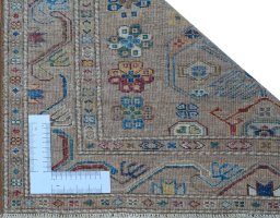 Corner detail of New Kazak rug showing border pattern and Wool pile