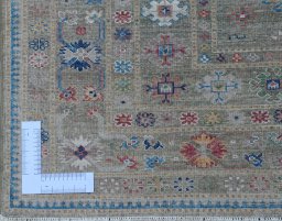 Corner detail of New Kazak rug showing border pattern and Wool pile