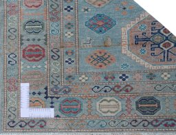 Corner detail of New Kazak rug showing border pattern and Wool pile