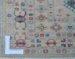 Corner detail of New Kazak rug showing border pattern and Wool pile