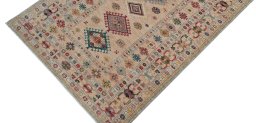 Backside of handmade New Kazak rug showing knot structure and weave density