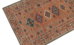 Backside of handmade New Kazak rug showing knot structure and weave density