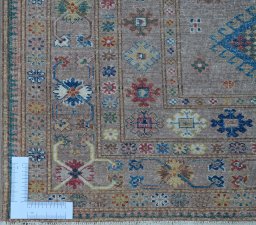 Corner detail of New Kazak rug showing border pattern and Wool pile