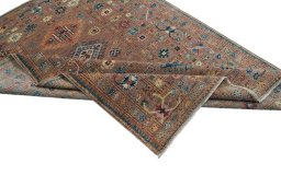 Backside of handmade New Kazak rug showing knot structure and weave density