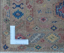 Corner detail of New Kazak rug showing border pattern and Wool pile