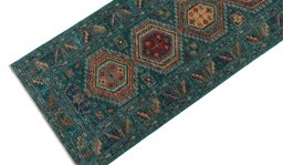 Backside of handmade New Kazak rug showing knot structure and weave density