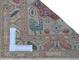 Corner detail of New Kazak rug showing border pattern and Wool pile