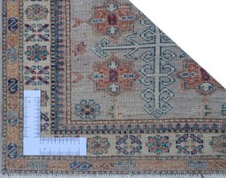 Corner detail of New Kazak rug showing border pattern and Wool pile