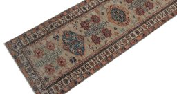 Backside of handmade New Kazak rug showing knot structure and weave density