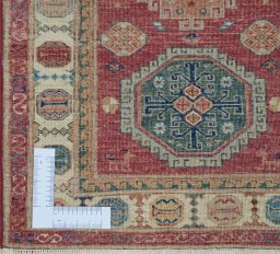 Corner detail of New Kazak rug showing border pattern and Wool pile
