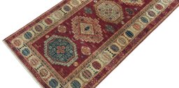 Backside of handmade New Kazak rug showing knot structure and weave density