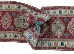 Full view of New Kazak rug from Pakistan, 284 × 78 cm in Red tones