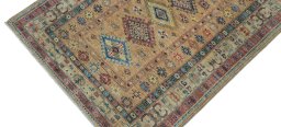 Backside of handmade New Kazak rug showing knot structure and weave density