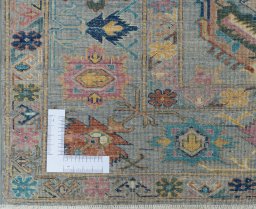 Corner detail of New Kazak rug showing border pattern and Wool pile