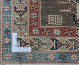 Corner detail of New Kazak rug showing border pattern and Wool pile