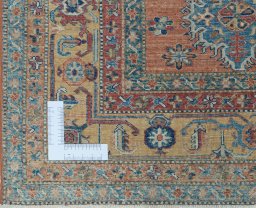 Corner detail of New Kazak rug showing border pattern and Wool pile