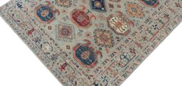 Backside of handmade New Kazak rug showing knot structure and weave density