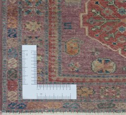 Corner detail of New Kazak rug showing border pattern and Wool pile
