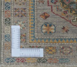 Corner detail of New Kazak rug showing border pattern and Wool pile